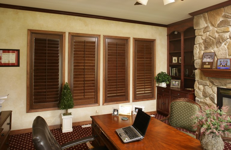 Wooden plantation shutters in a Charlotte home office